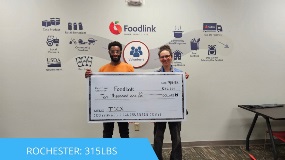 Rochester employees presenting a donation check to Foodlink